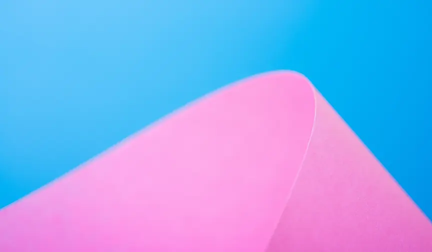 Closeup of a pink object against a blue sky