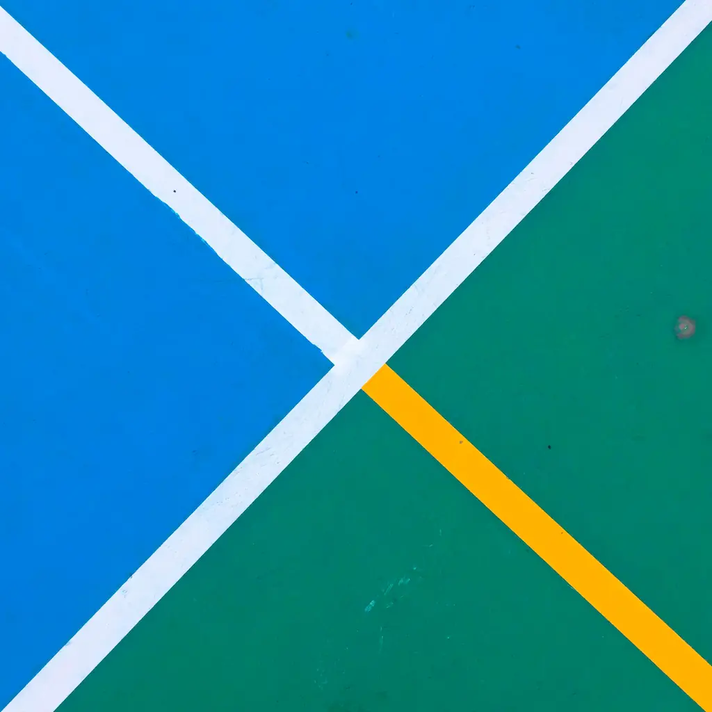 Minimalist geometric design with blue and green areas divided by white and yellow lines