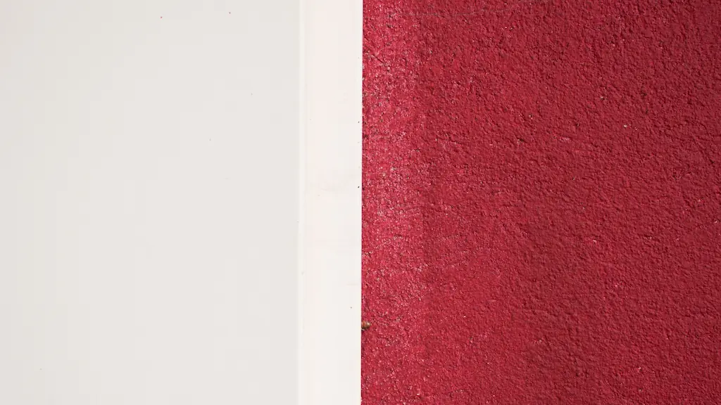Minimalist composition of white and deep red painted wall textures